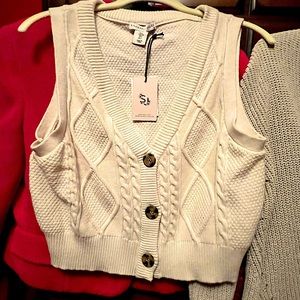 V neck sweater vest.